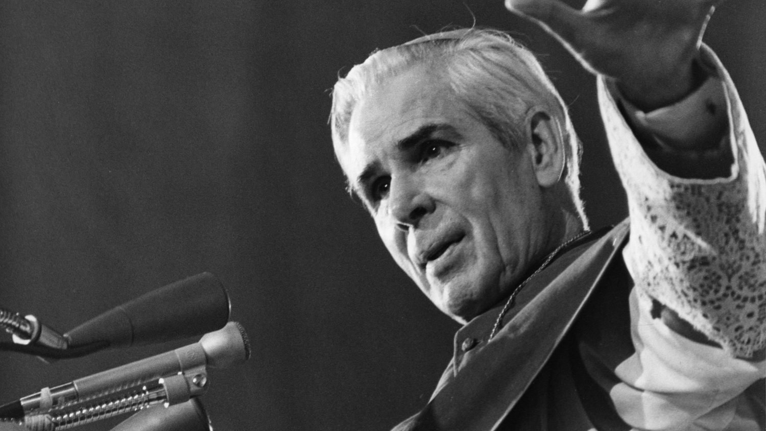 Archbishop Sheen preaching with a raised hand