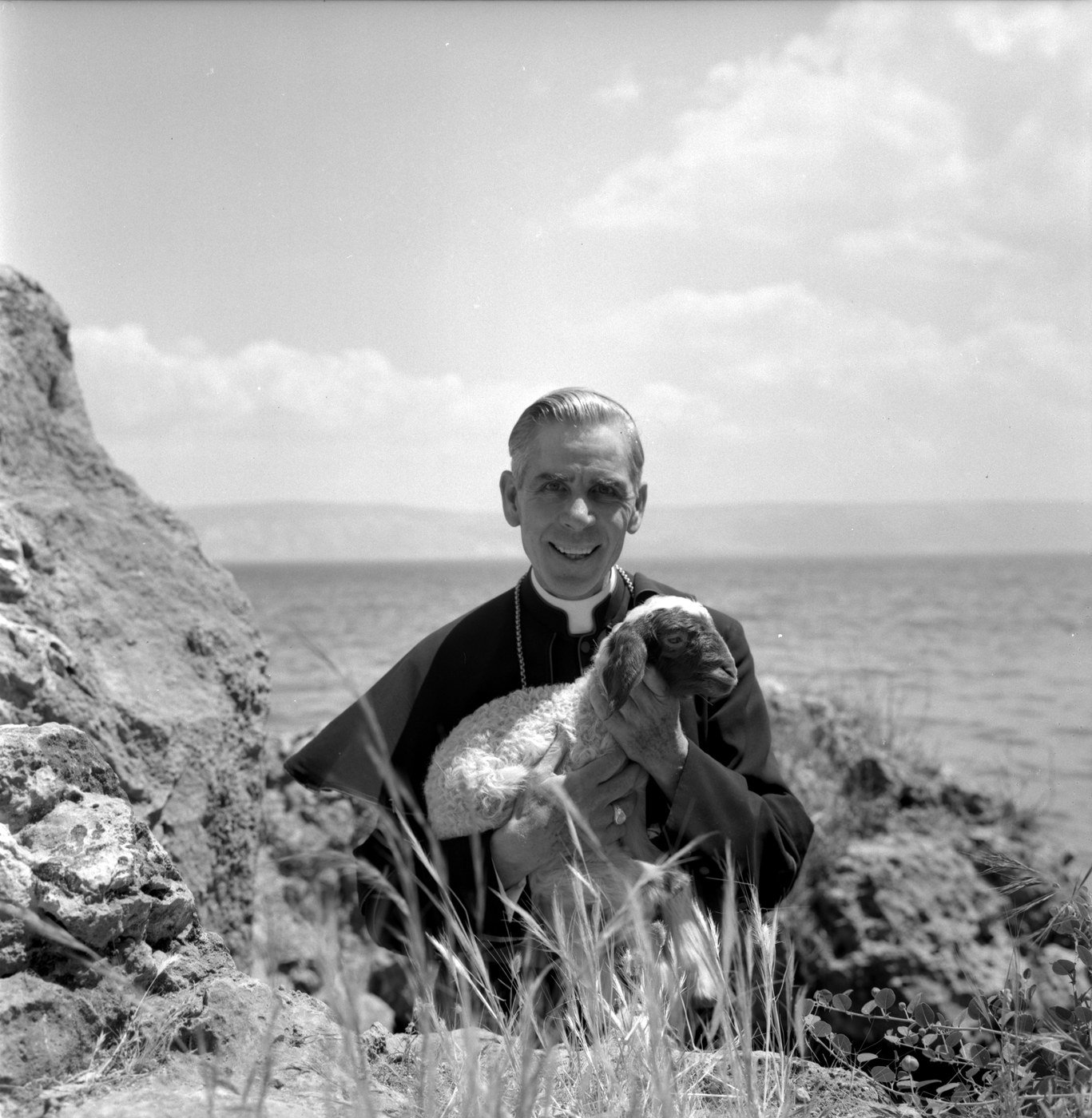Bishop Fulton J. Sheen holding a lamb, by Yousuf Karsh