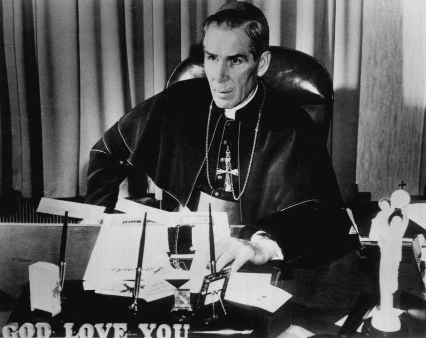 Archbishop Fulton J. Sheen at his desk, 1956